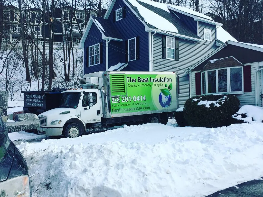 The Best Insulation truck at a home in a Massachusetts winter
